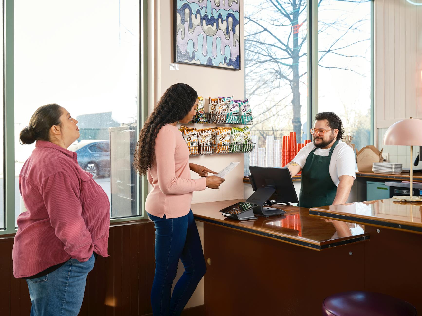 customer service interaction at restaurant counter