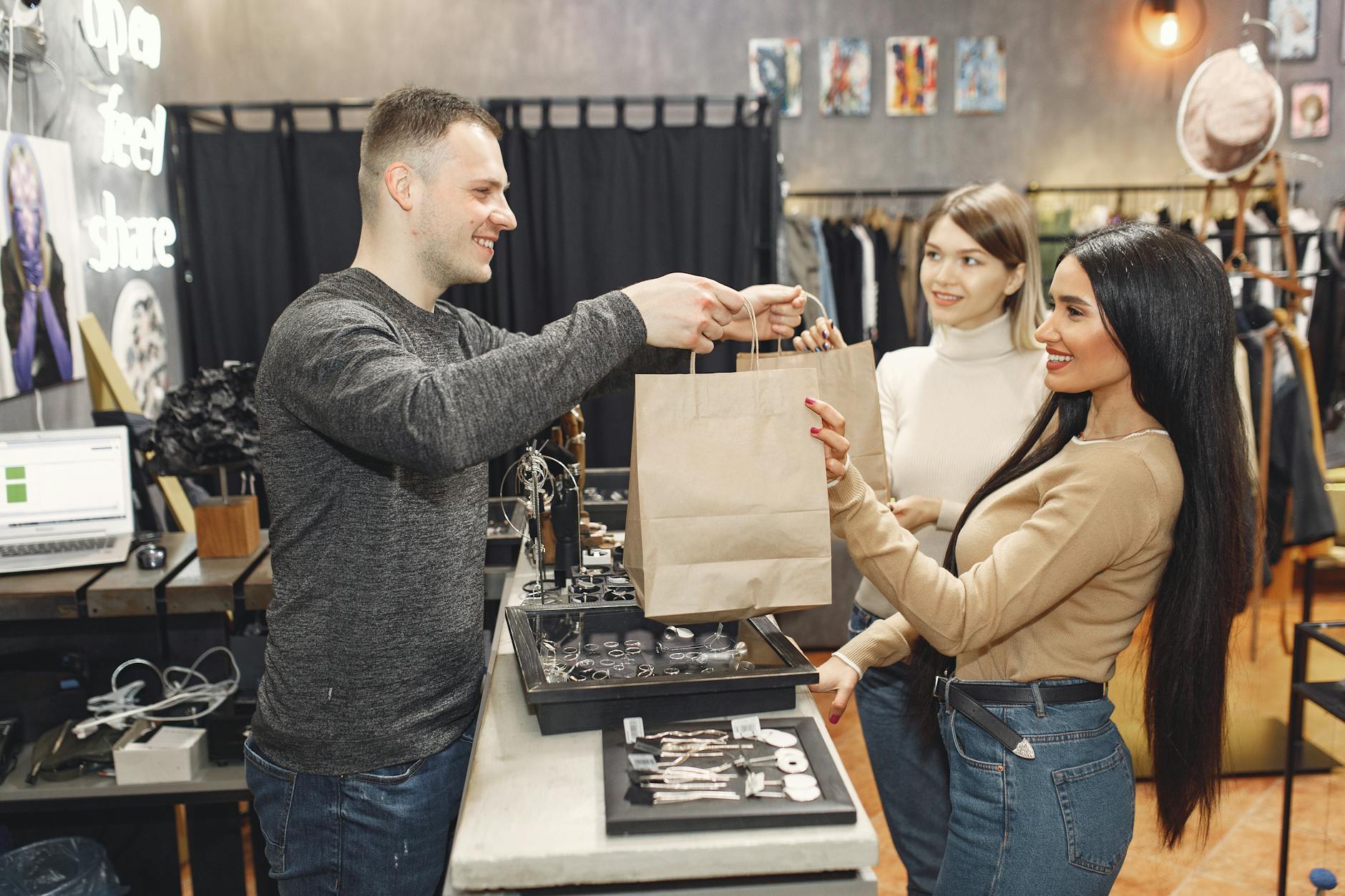 female customers getting paper bags at counter desk