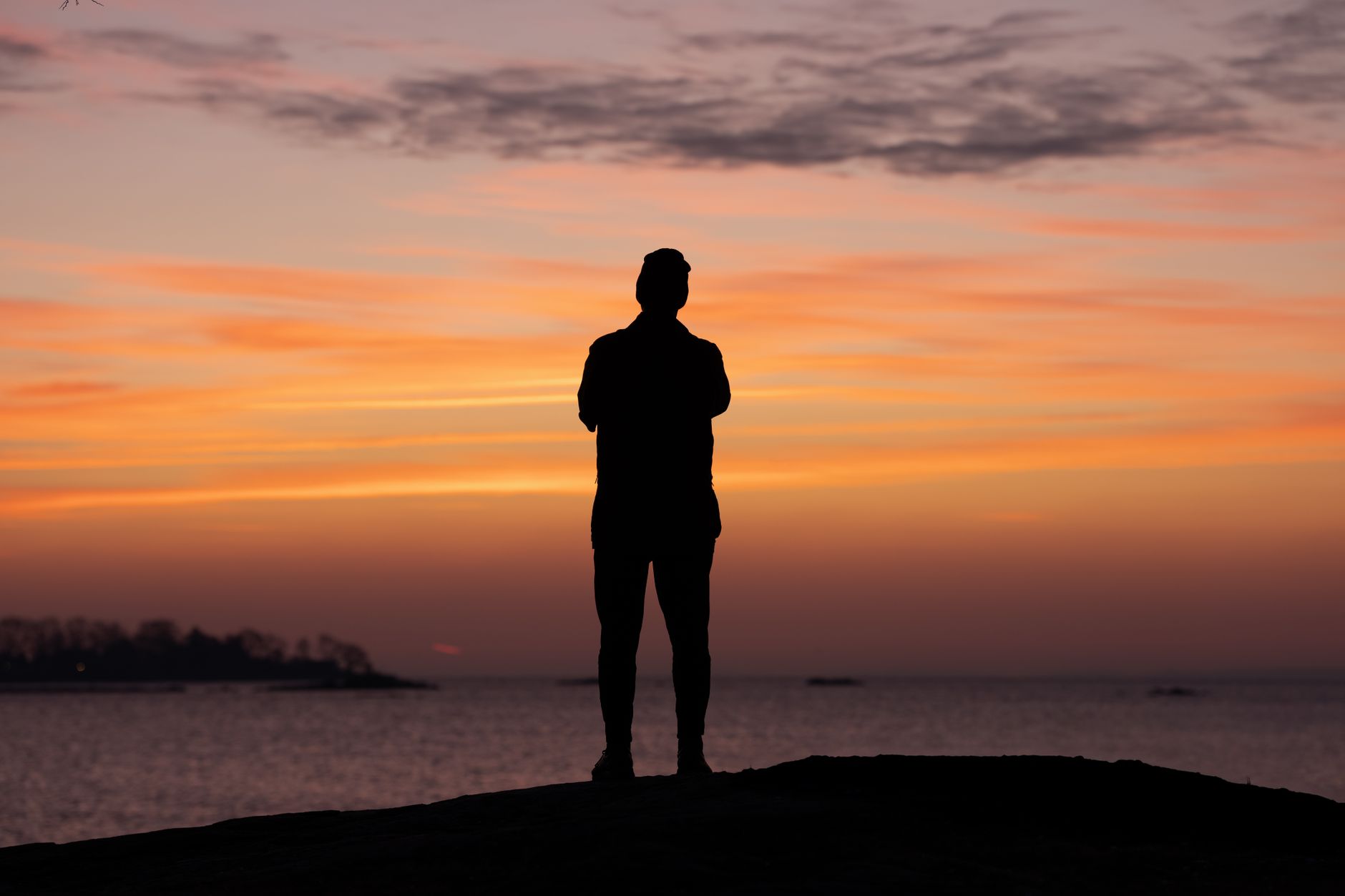 silhouette at sunrise over cove island park